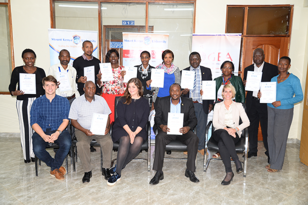 STEP Trainers from MKU and KNATCOM display their certificates. With them is the team of trainers from Leuphana University Germany.
